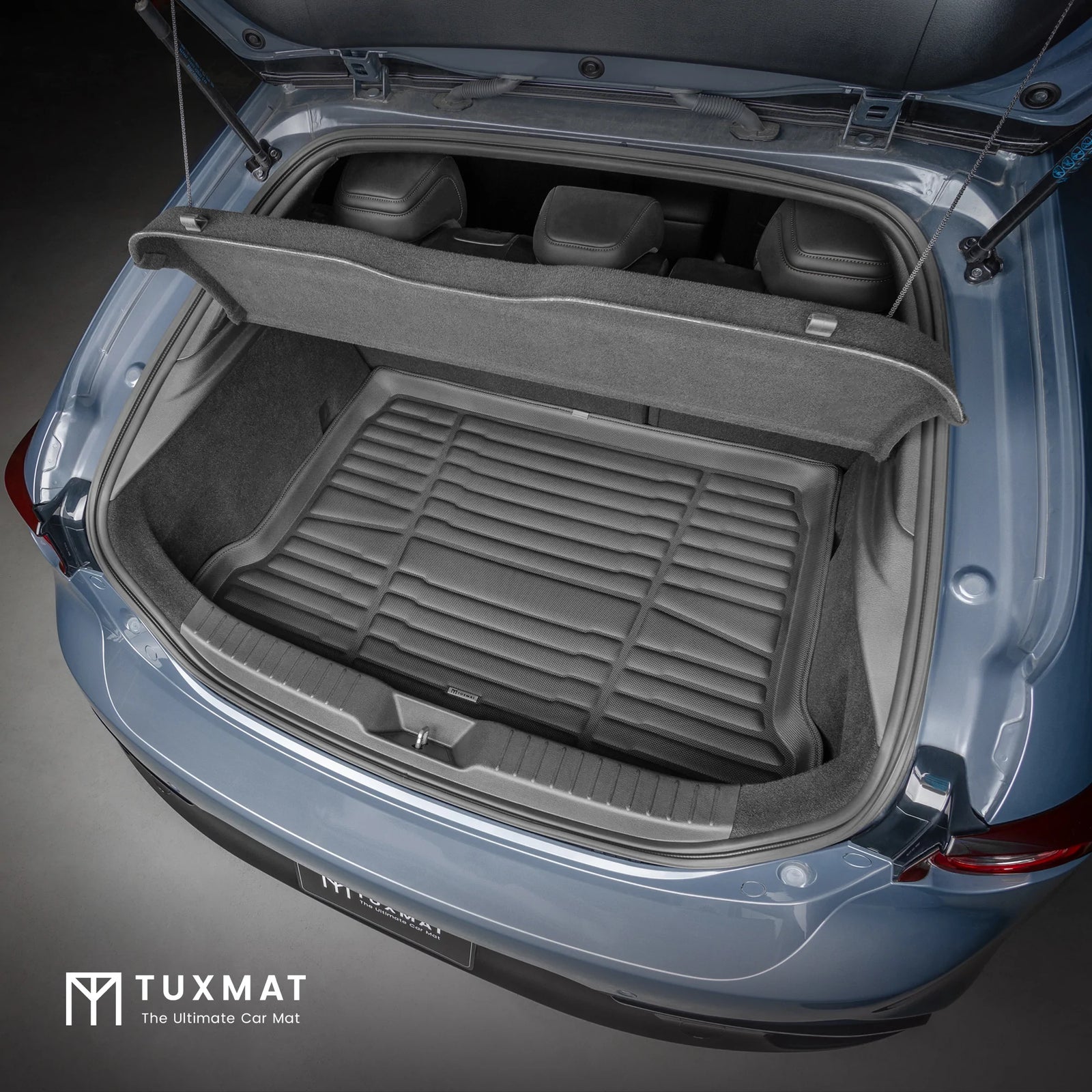 Car trunk with TuxMat cargo liner on a dark background