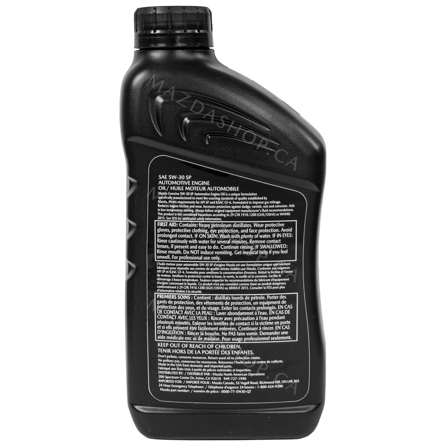 Black oil bottle with label on a white background